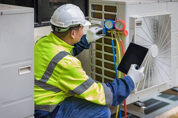 Professional Hvac technician working in Rossville, MD